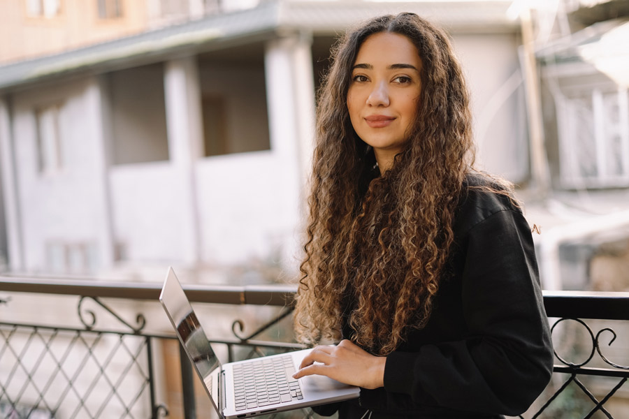 Business woman holding laptop