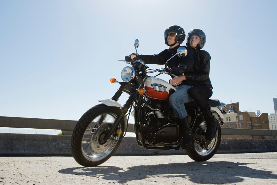 Couple riding motorcycle